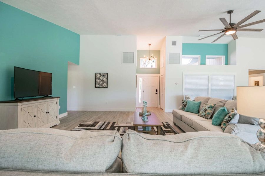 Living room with tv console and front door — Custom home addition, pool, and renovation, Bradenton