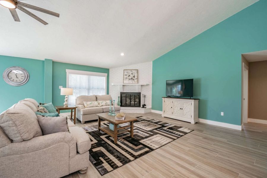 Living room with fireplace and tv console — Custom home addition, pool, and renovation, Bradenton