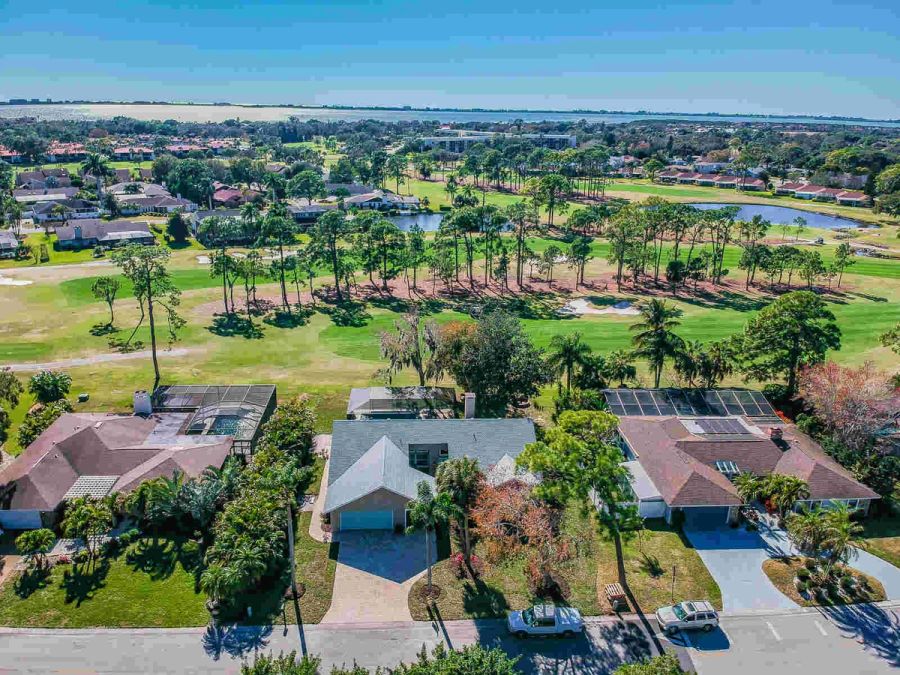 Aerial view of house with golf course and bay — Custom home addition, pool, and renovation, Bradenton