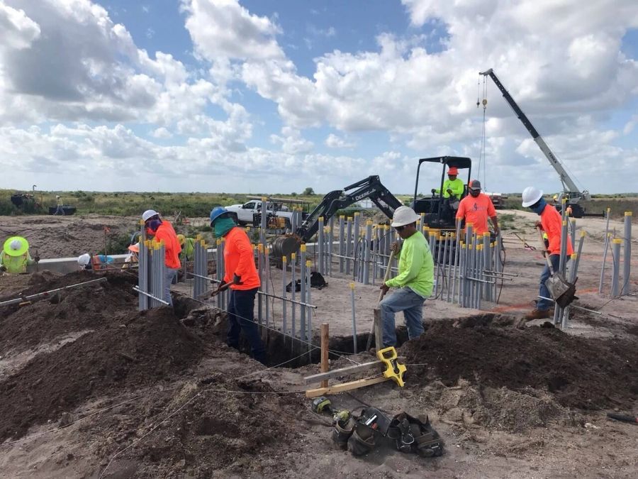 Trench digging conduit crane — Florida Everglades Annex Restoration