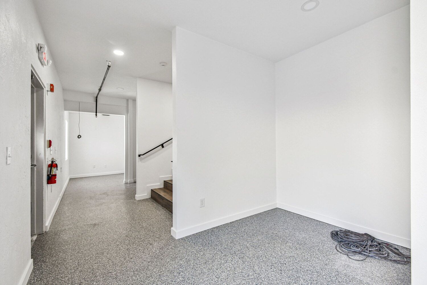 Back hallway with epoxy floors in custom church project — Roser Memorial Community Church, Anna Maria, FL