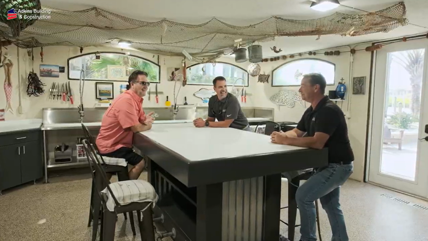 Owners and builder talking at the fish camp island — Custom home addition, Cortez