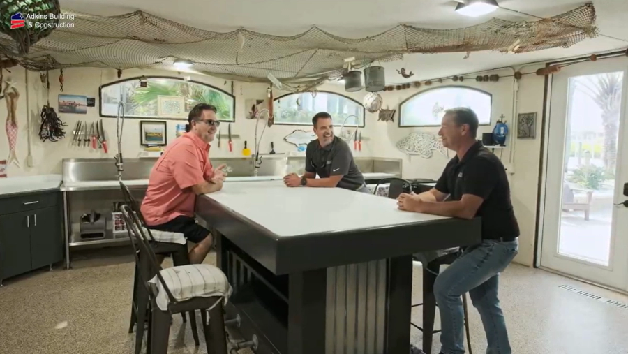 Owners and builder talking at the fish camp island — Custom home addition, Cortez