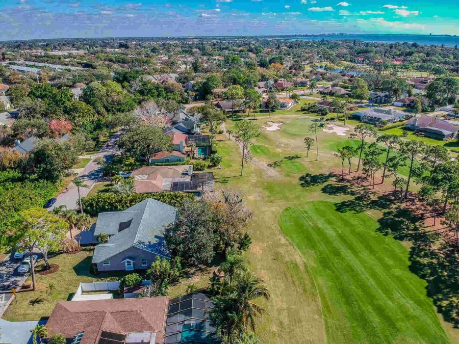 Aerial view of neighborhood golf course and bay — Custom home addition, pool, and renovation, Bradenton