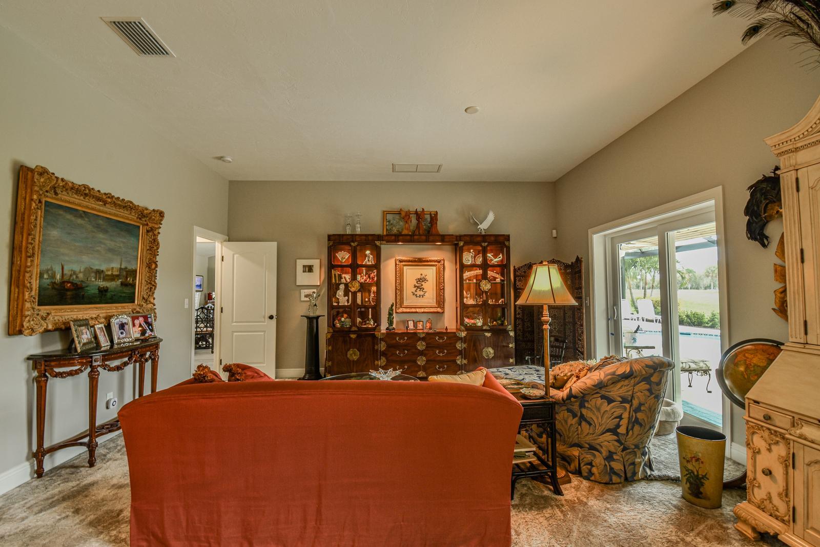 Sitting room curio cabinet — Custom design-build near IMG Academy, West Bradenton