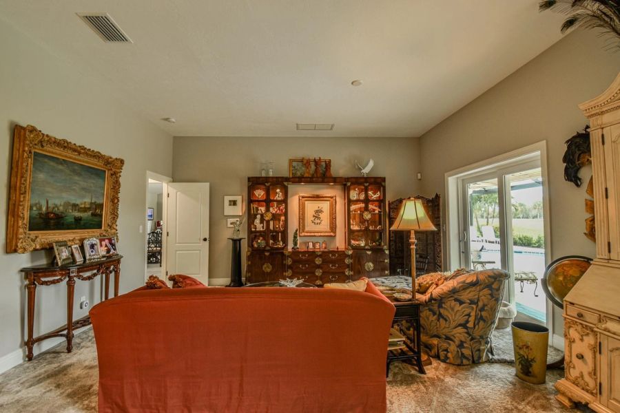 Sitting room curio cabinet — Custom design-build near IMG Academy, West Bradenton