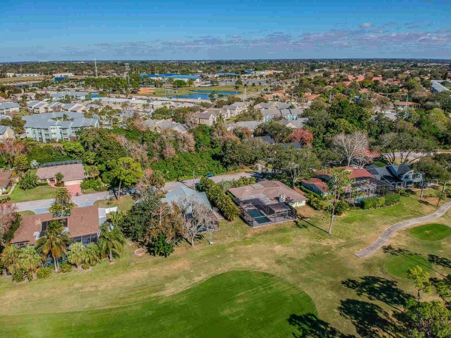 Aerial view of neighborhood and distant schools — Custom home addition, pool, and renovation, Bradenton