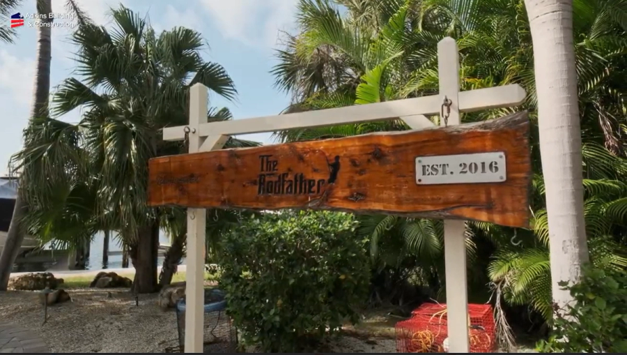 Carved wood sign at the property entrance — Custom home addition, Cortez