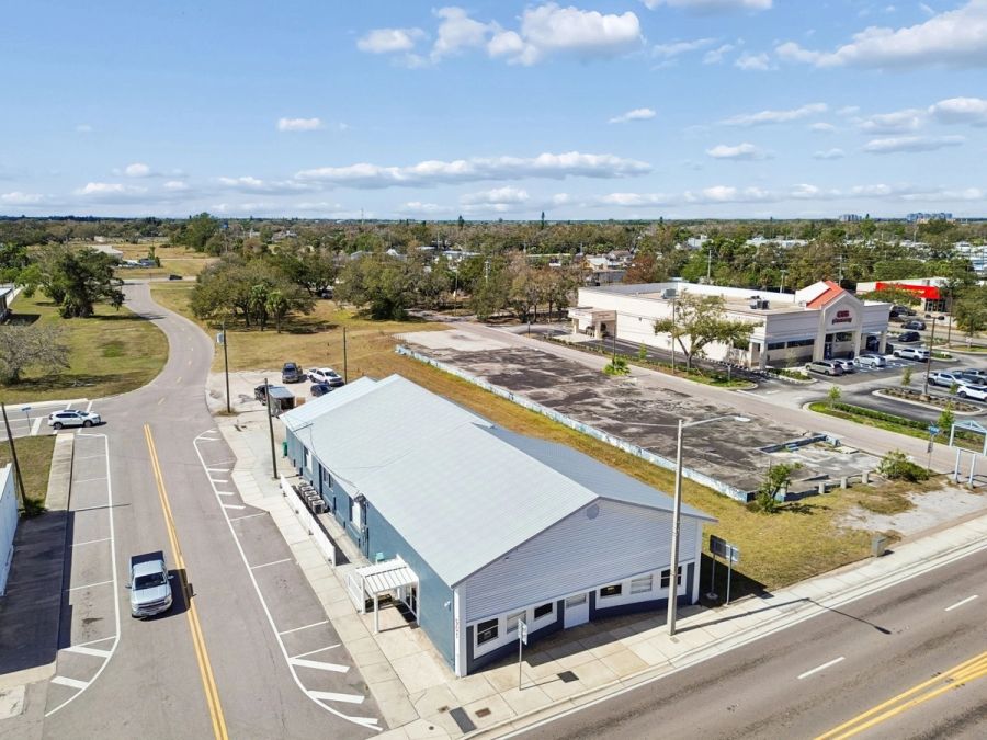 Aerial side view metal roof corner intersection — Commercial building renovation, Palmetto