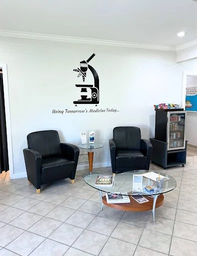 Lobby seating beneath a microscope wall graphic, Bradenton Research Center