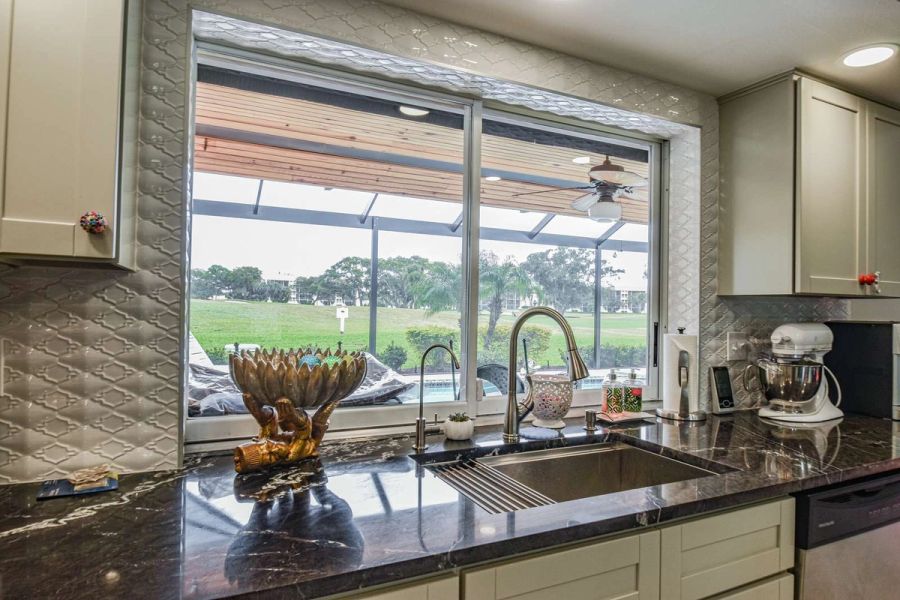 Kitchen sink window golf view — Custom design-build near IMG Academy, West Bradenton
