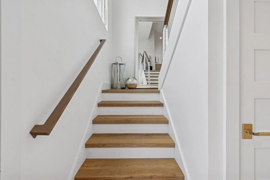Interior staircase wood treads white risers — New home construction, Longboat Key