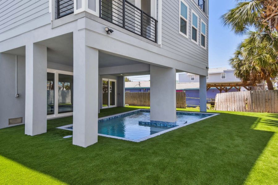 Custom backyard pool installation — Coastal custom home, Bradenton Beach