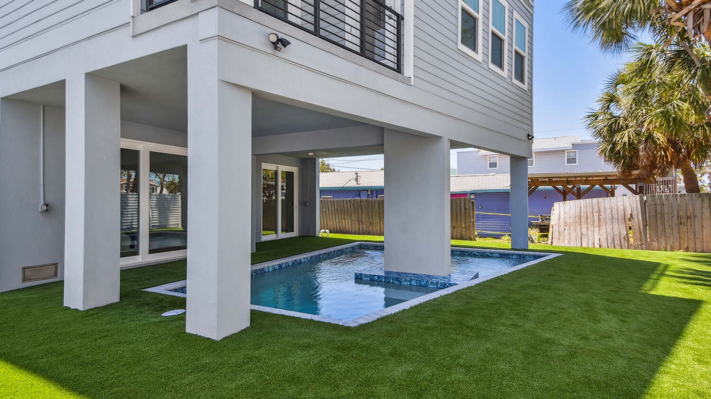 Custom backyard pool installation — Coastal custom home, Bradenton Beach