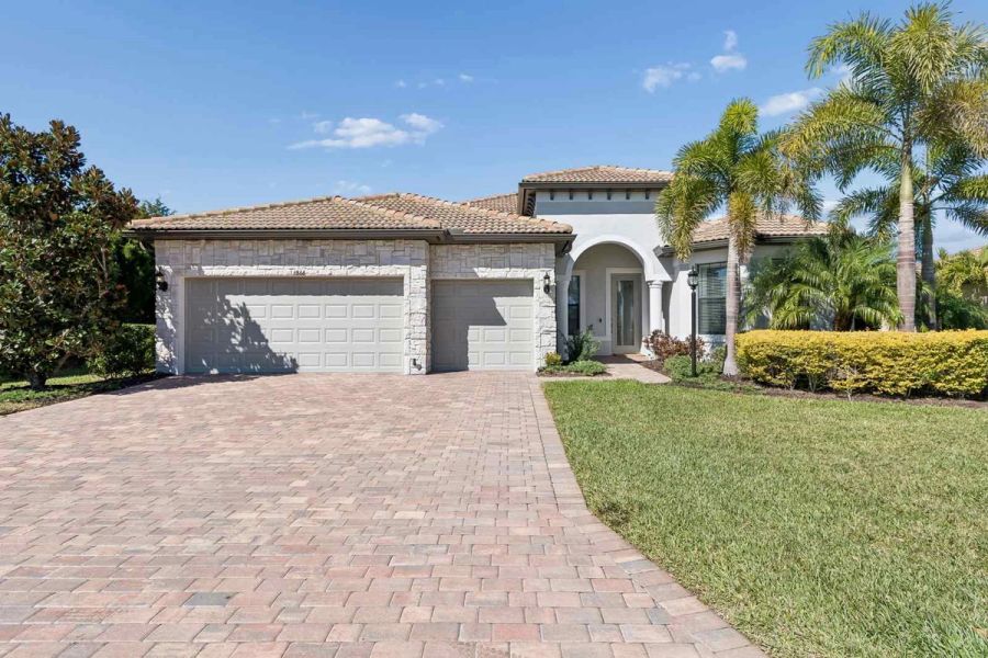 Exterior front three car garage — Whole-home renovation, Bradenton