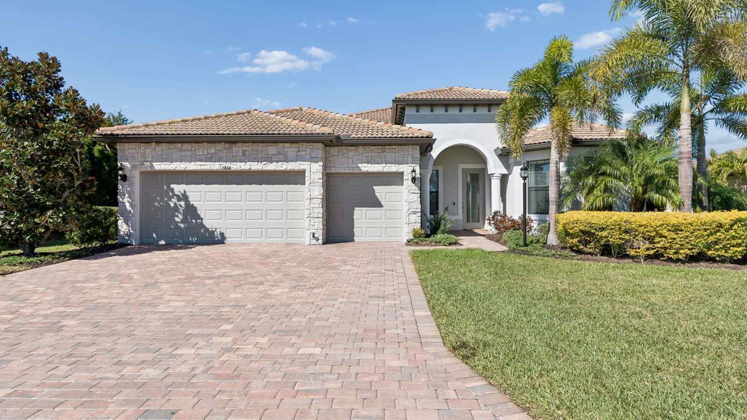Exterior front three car garage — Whole-home renovation, Bradenton