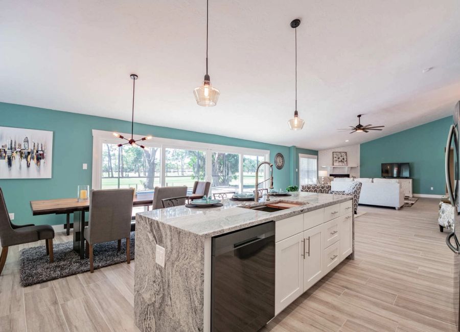 Kitchen island with dining table and pool view — Custom home addition, pool, and renovation, Bradenton