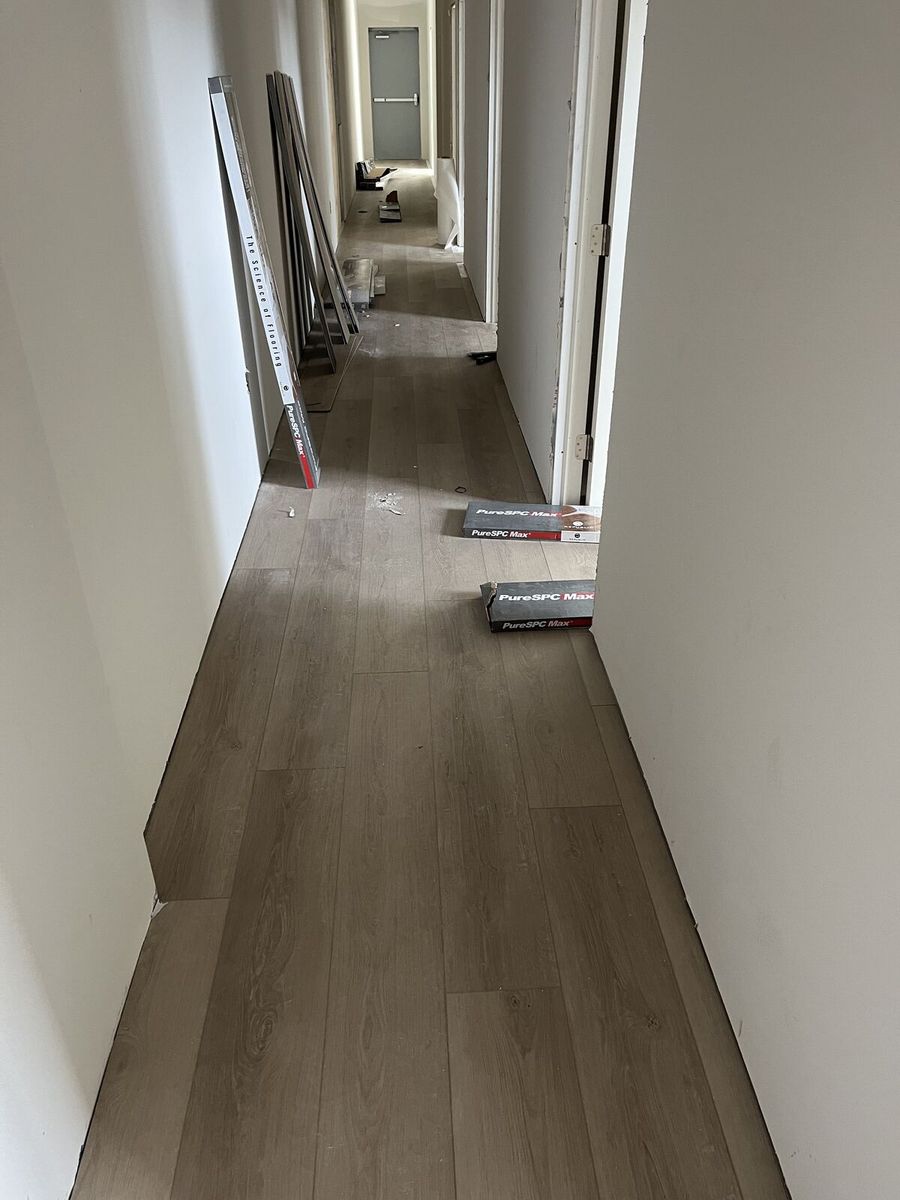 Hallway vinyl plank flooring installation — Bradenton Research Center