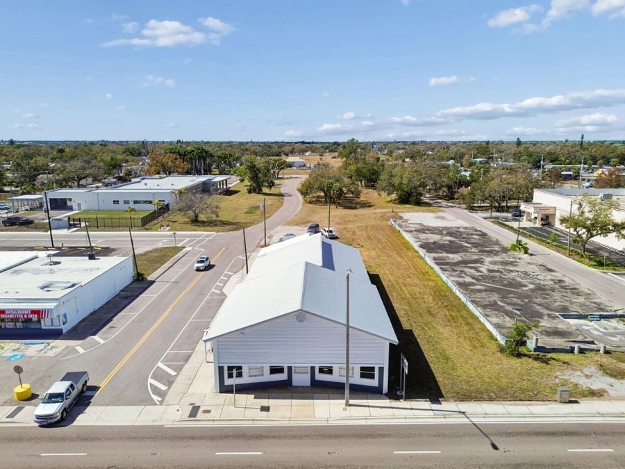 Aerial rear angle metal roof side street wide view — Commercial building renovation, Palmetto