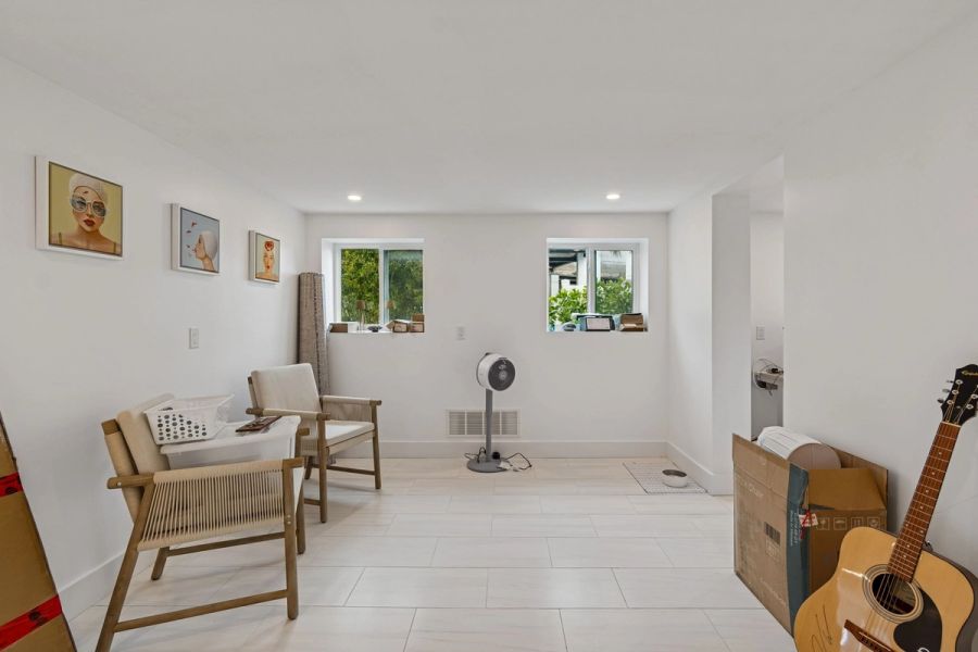 Interior bonus room tile floor natural chairs — New home construction, Longboat Key
