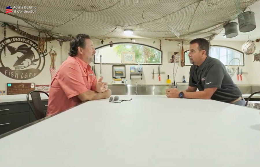 Conversation at the fish camp table during the project tour — Custom home addition, Cortez