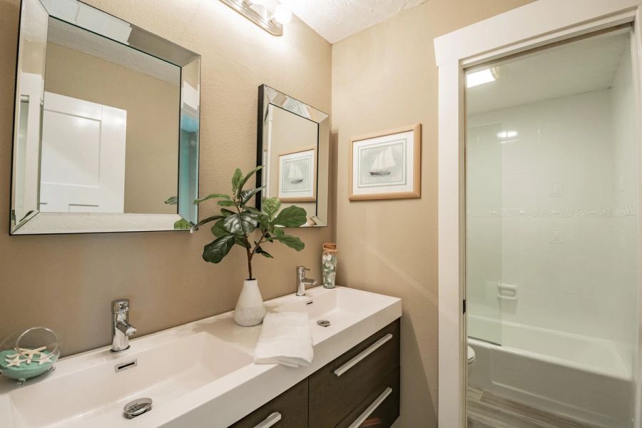 Guest bathroom with dark wood vanity — Custom home addition, pool, and renovation, Bradenton