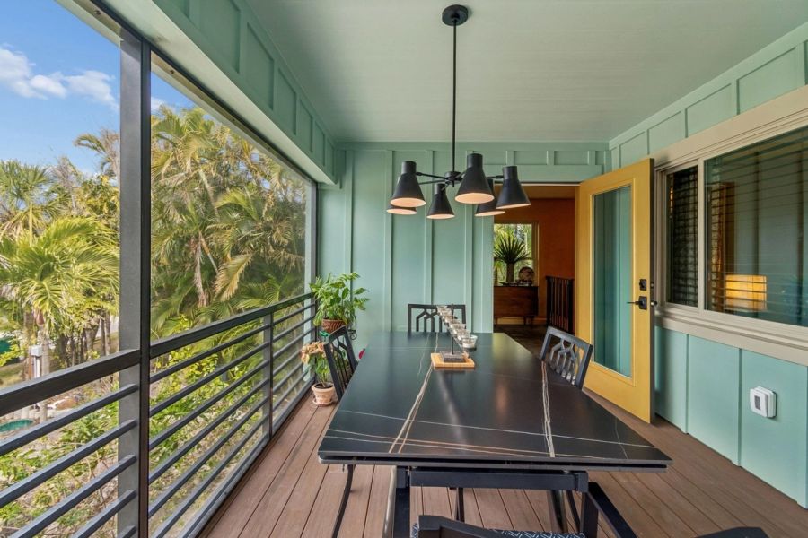 Exterior screened porch dining area black table pendant light — Custom home addition, Longboat Key