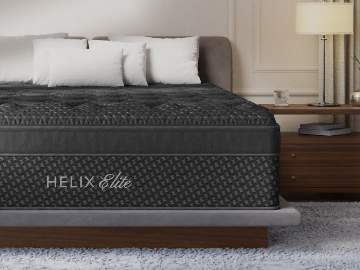 Helix Midnight Elite mattress made up on a platform bed in a bedroom