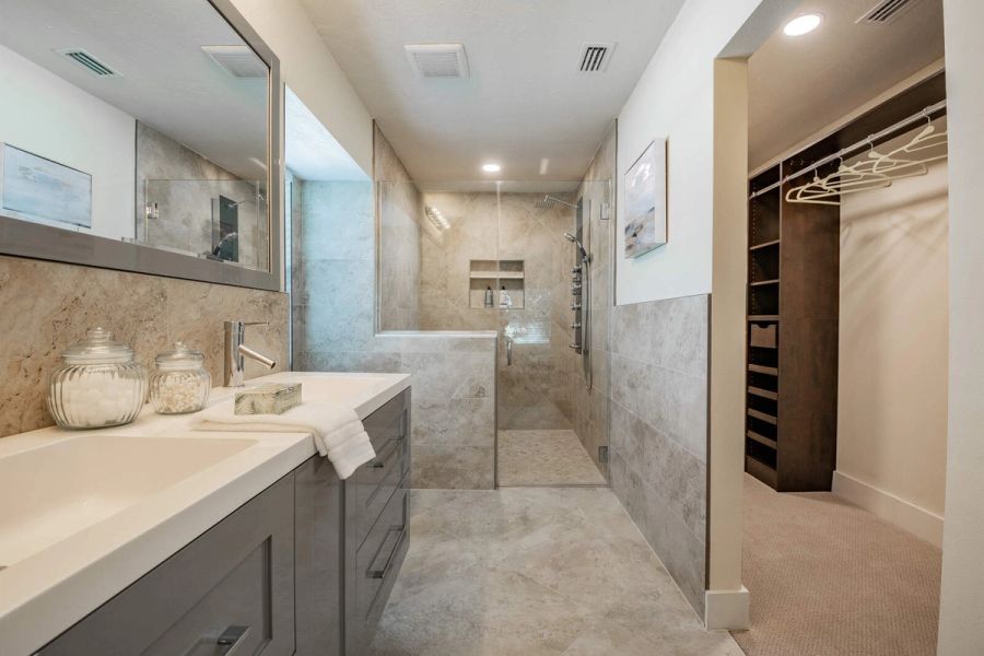 Primary bathroom with shower and closet view — Custom home addition, pool, and renovation, Bradenton