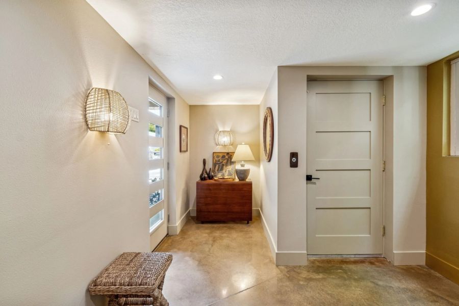 Interior ground floor foyer polished concrete woven sconce console table — Custom home addition, Longboat Key