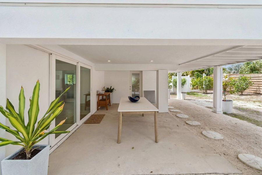 Covered patio outdoor dining sliding doors — New home construction, Longboat Key