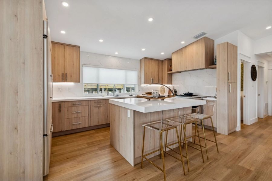 Interior kitchen full view island wood cabinetry marble backsplash — New home construction, Longboat Key