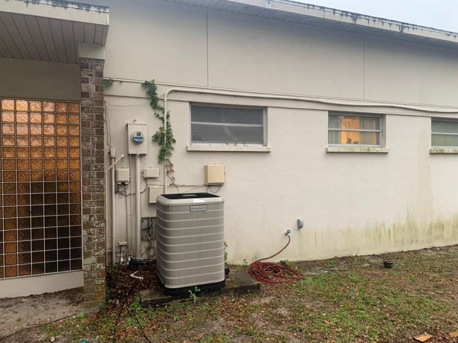 Before: hvac unit exterior wall — Bradenton Research Center