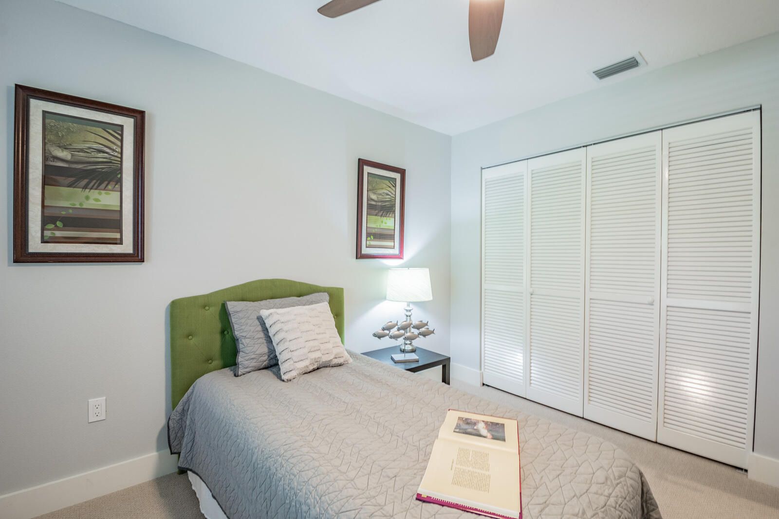 Bedroom green headboard and closet — Custom home addition, pool, and renovation, Bradenton
