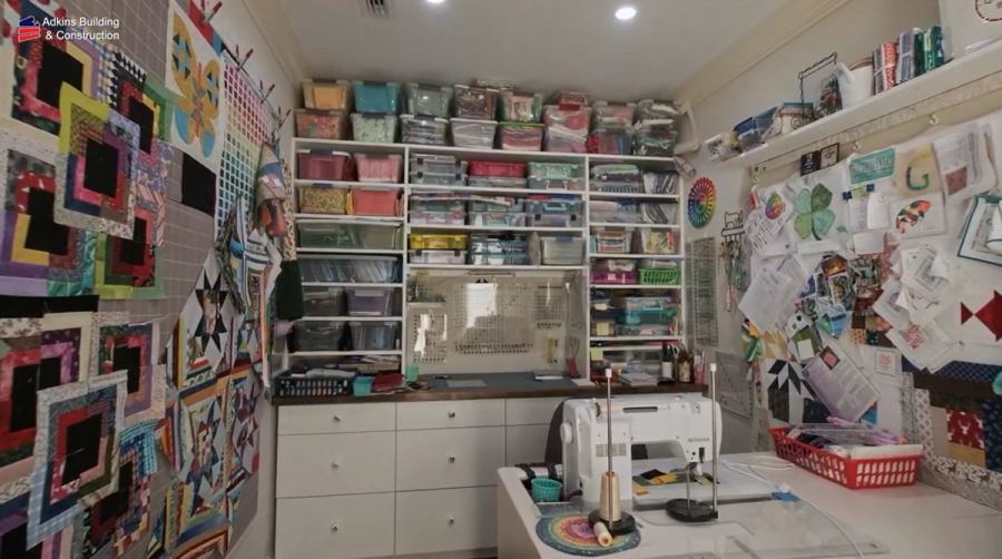 Craft room with built-in shelving and sewing station — Custom home addition, Cortez