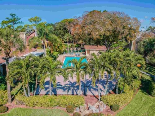 Aerial view of community pool and tennis court — Custom home addition, pool, and renovation, Bradenton