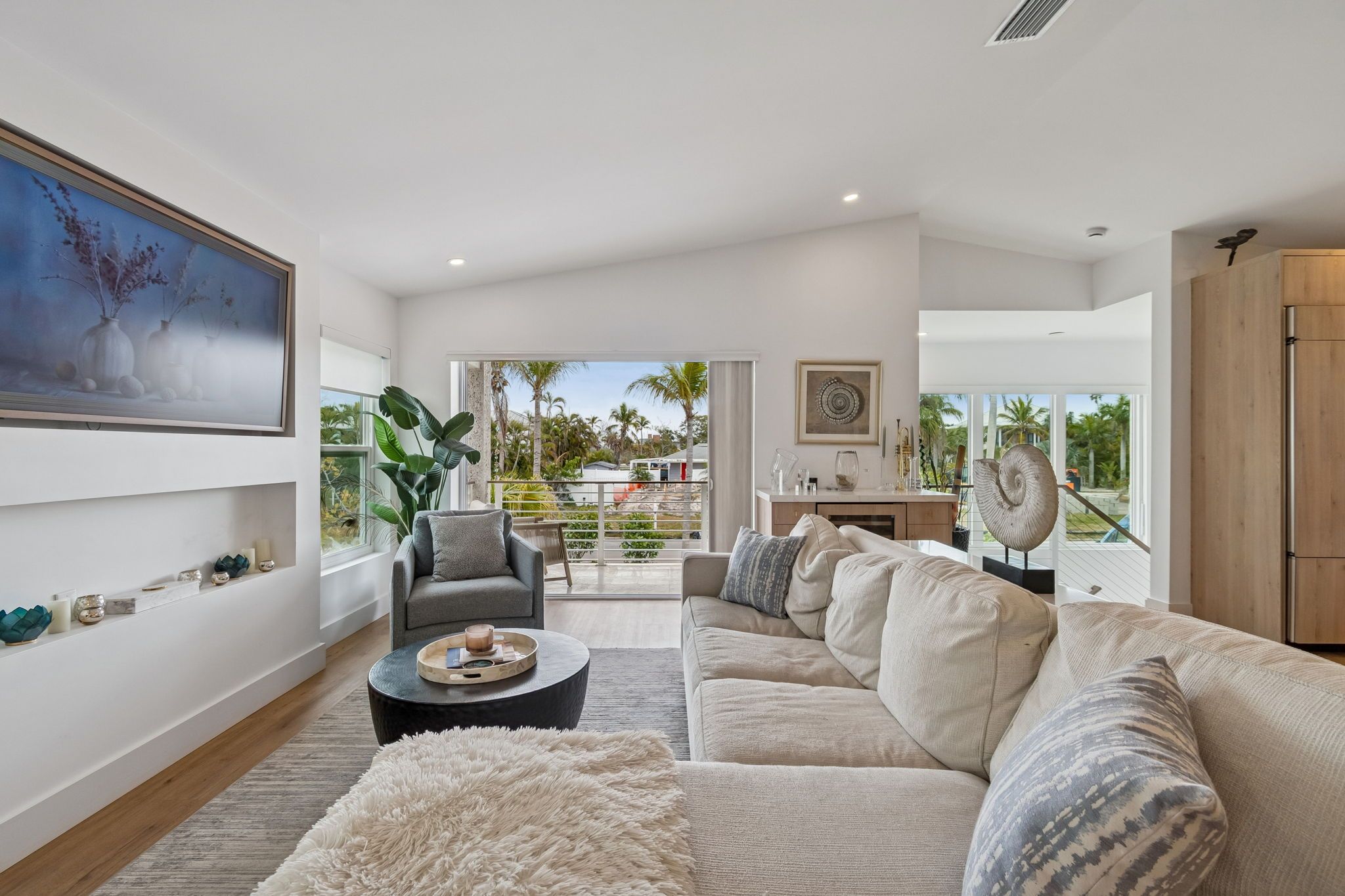 Living room seating area with large artwork — New home construction, Longboat Key