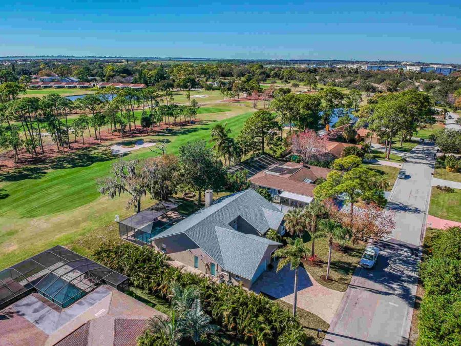 Aerial view of house with golf course and neighborhood — Custom home addition, pool, and renovation, Bradenton