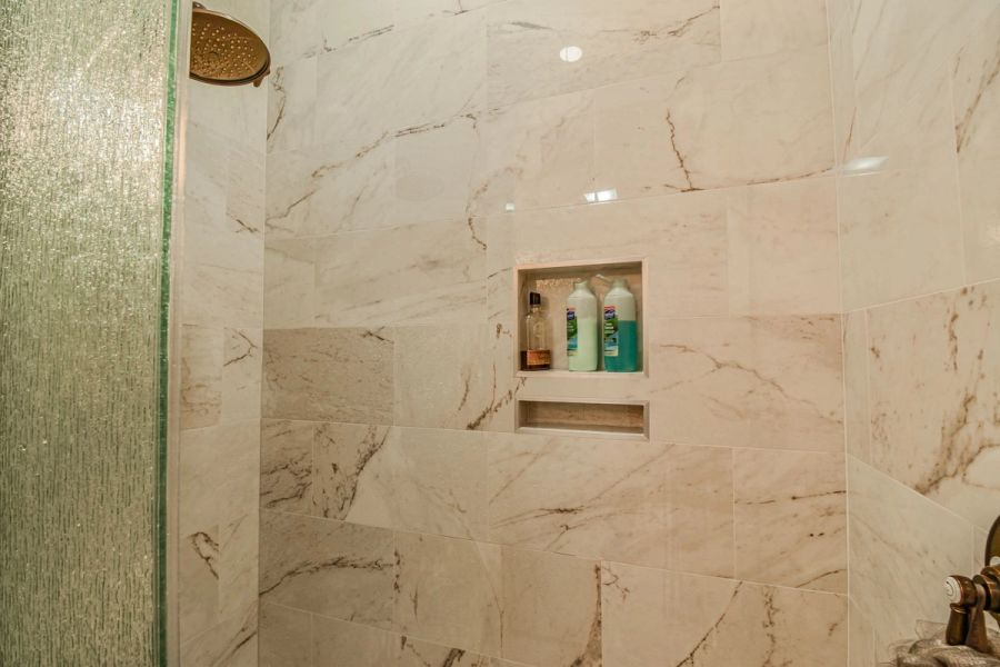 Shower niche marble tile — Custom design-build near IMG Academy, West Bradenton