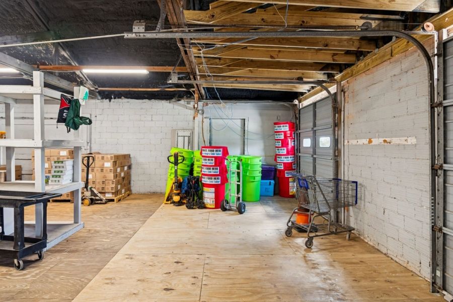 Interior commercial warehouse space open bay garage door — Commercial building renovation, Palmetto