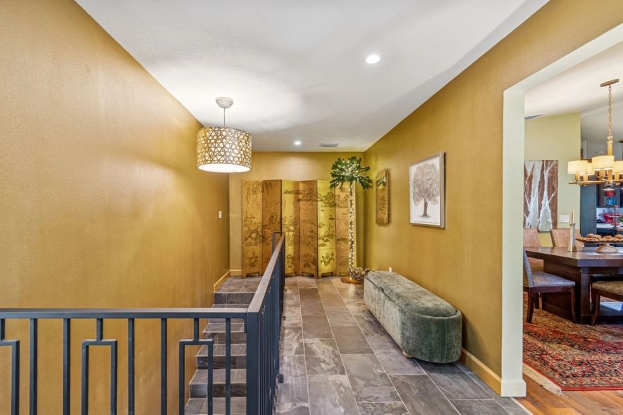 Interior upper hallway gold screen panel velvet bench — Custom home addition, Longboat Key