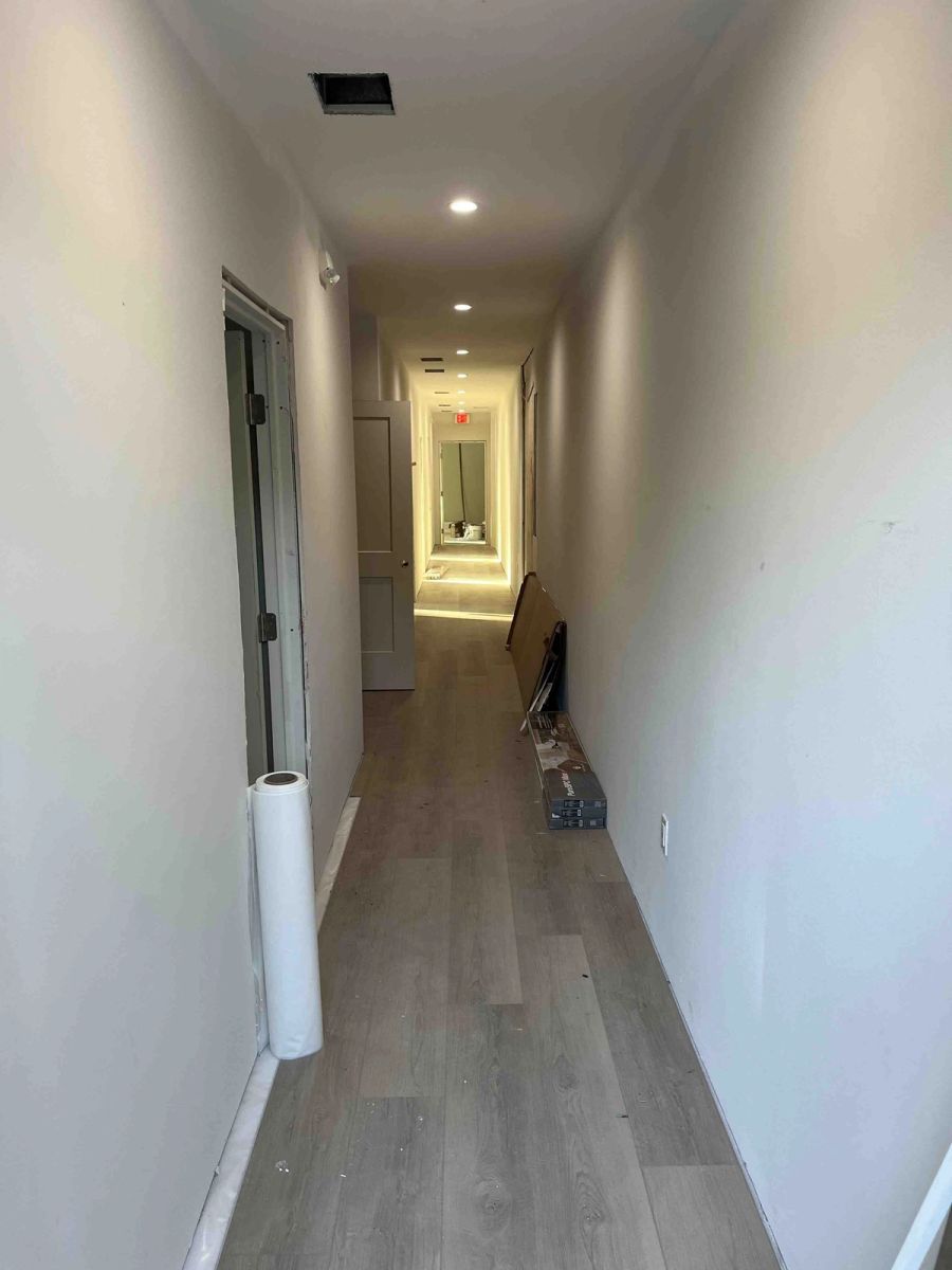 Hallway flooring installation progress — Bradenton Research Center