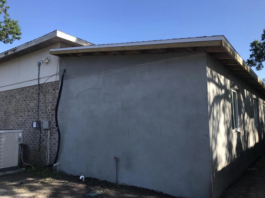 Exterior addition corner stucco brick ac unit — Bradenton Research Center