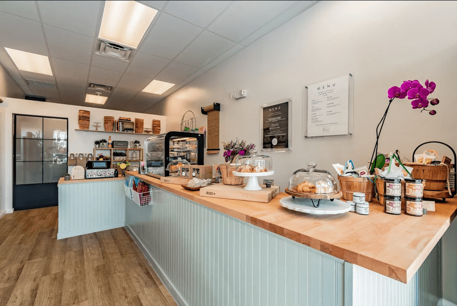 Retail counter with bakery display and butcher-block top — Graze Street renovation, Holmes Beach, FL