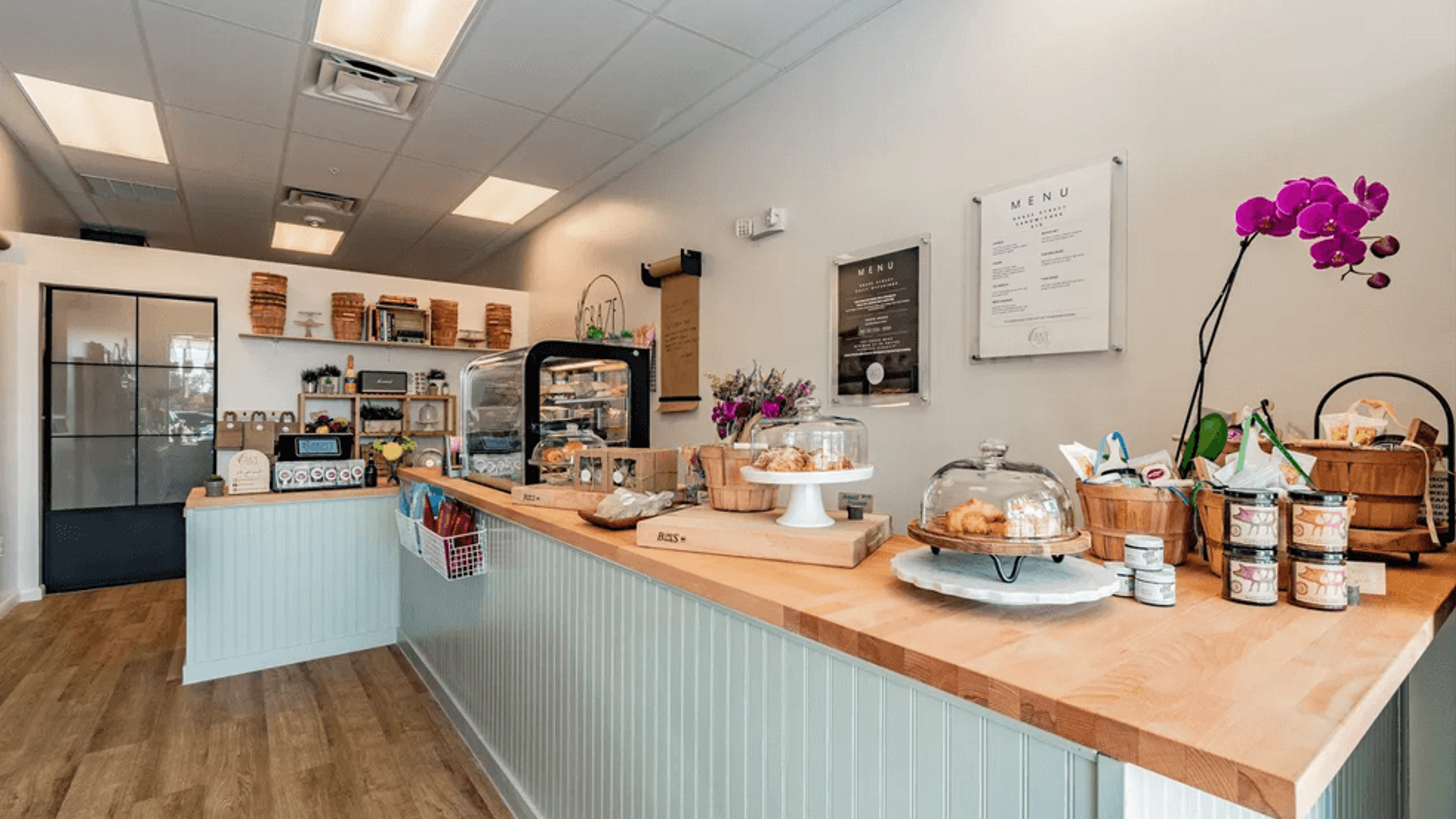 Retail counter with bakery display and butcher-block top — Graze Street renovation, Holmes Beach, FL