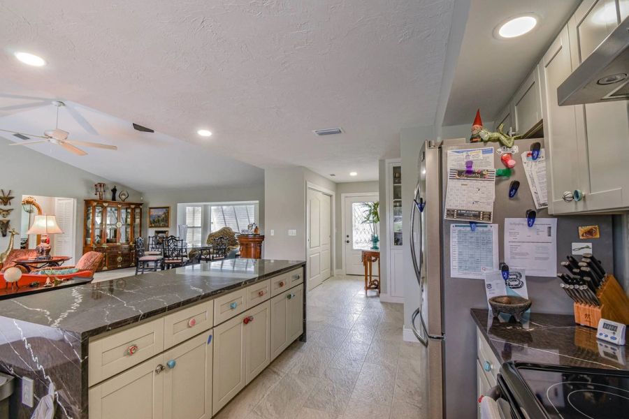 Kitchen fridge hallway view — Custom design-build near IMG Academy, West Bradenton