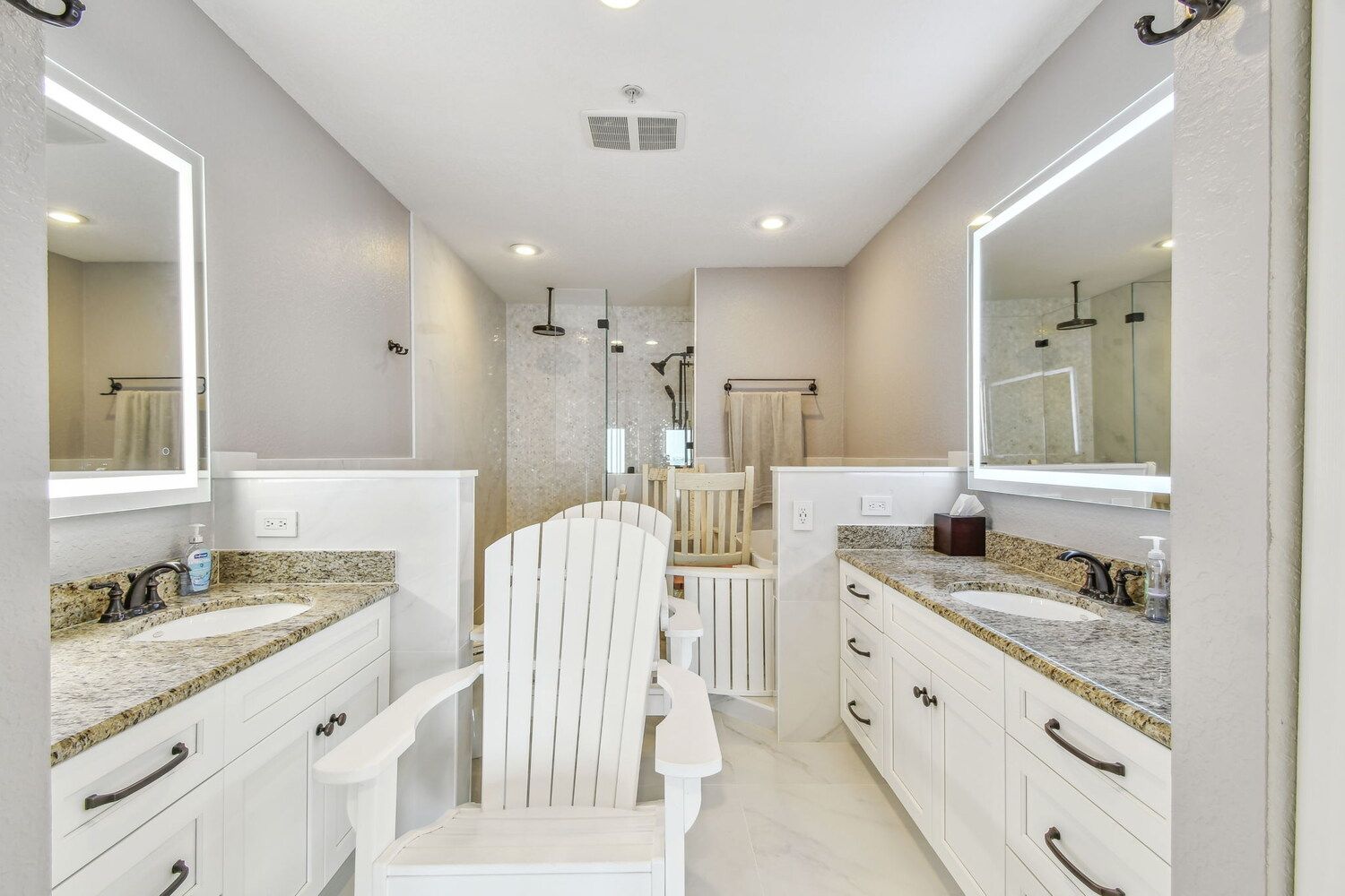 Dual-sink vanity and walk-in shower in luxury custom bathroom — Waterfront condo renovation, Bradenton, FL