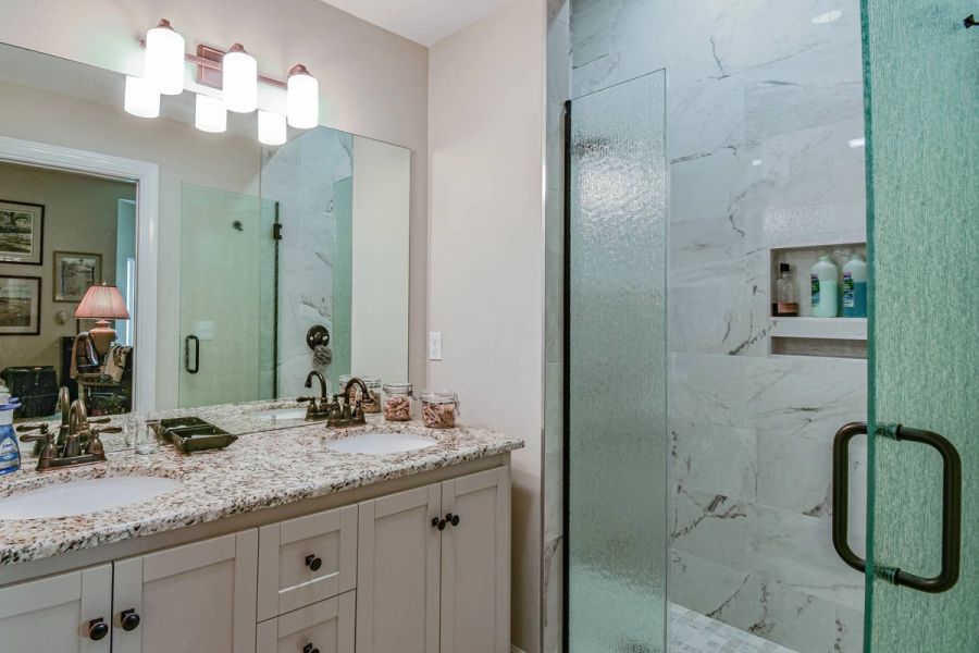 Guest bath granite vanity shower — Custom design-build near IMG Academy, West Bradenton