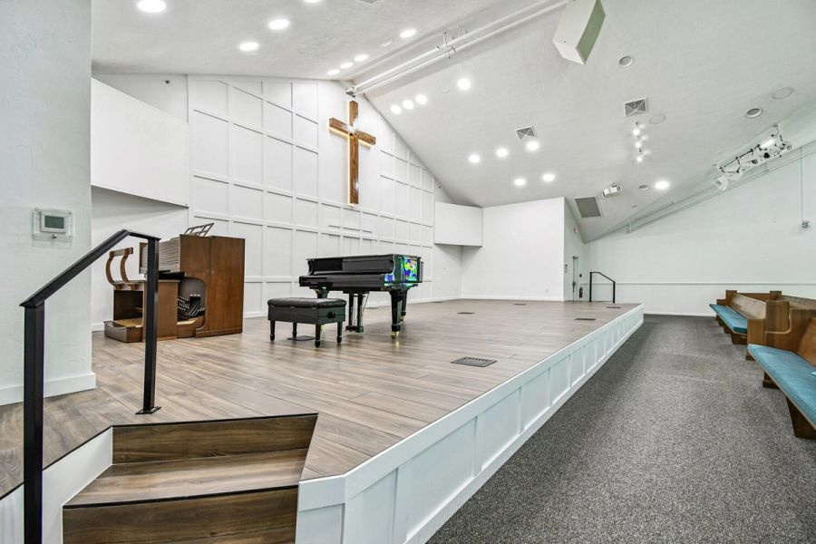 Close-up of elevated church stage with hardwood flooring — Roser Memorial Community Church, Anna Maria, FL