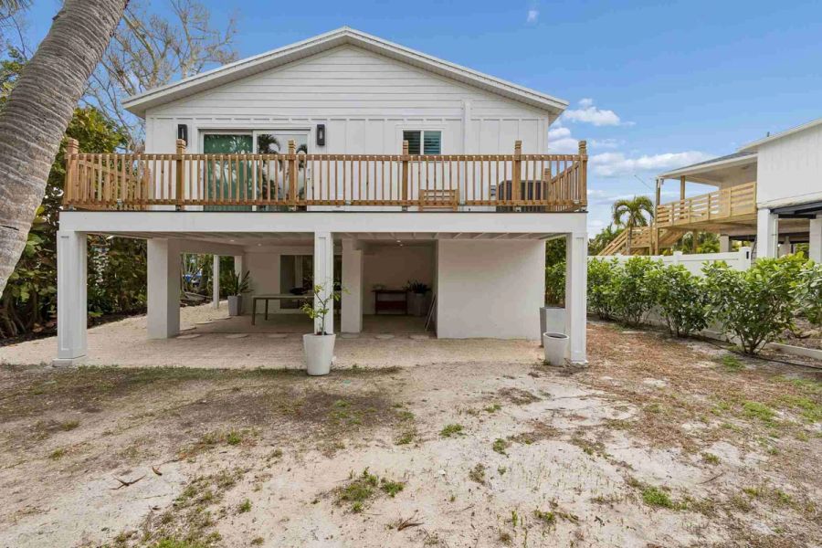 Rear exterior elevated stilts wood deck — New home construction, Longboat Key